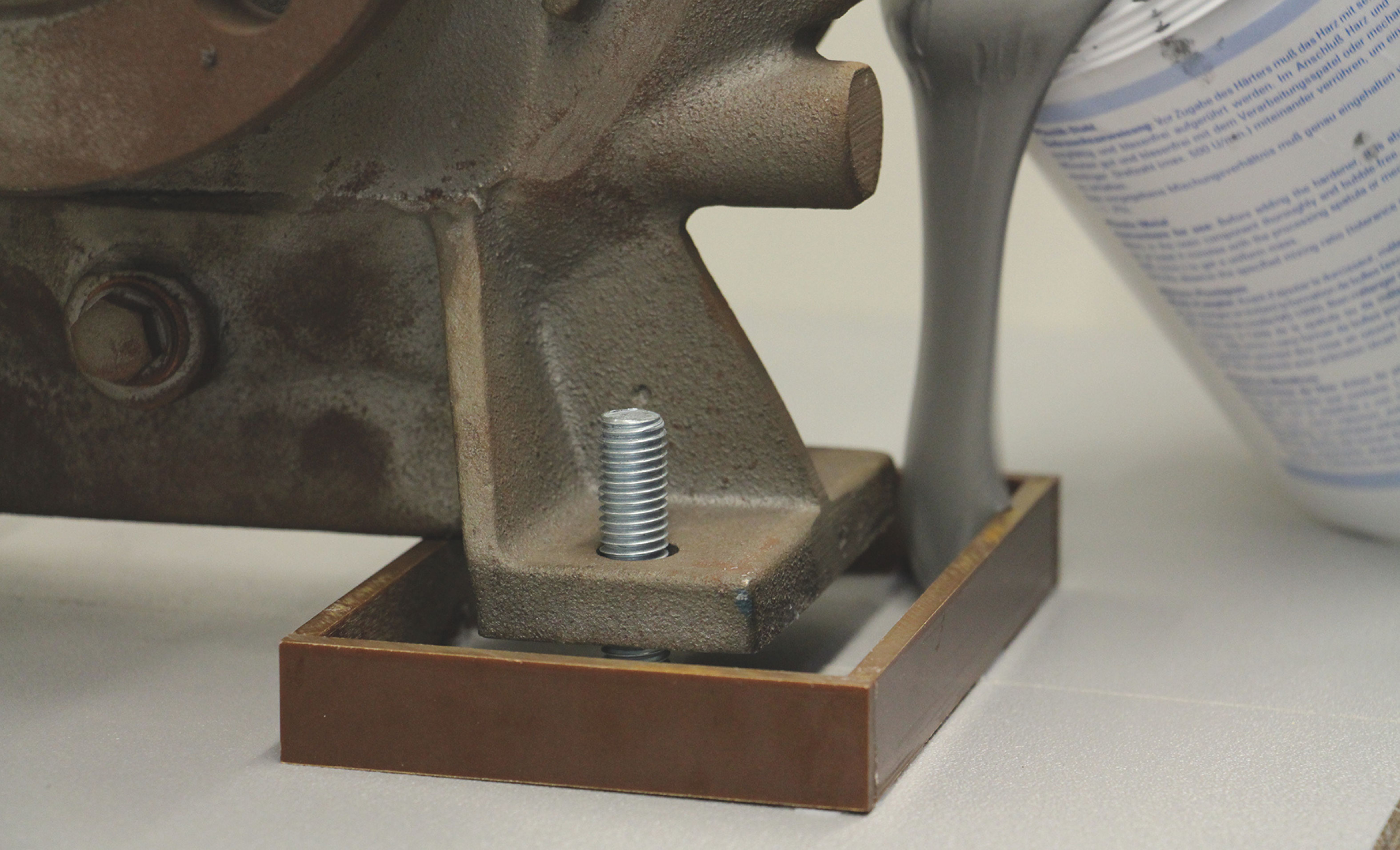 Grouting compound is poured into a base